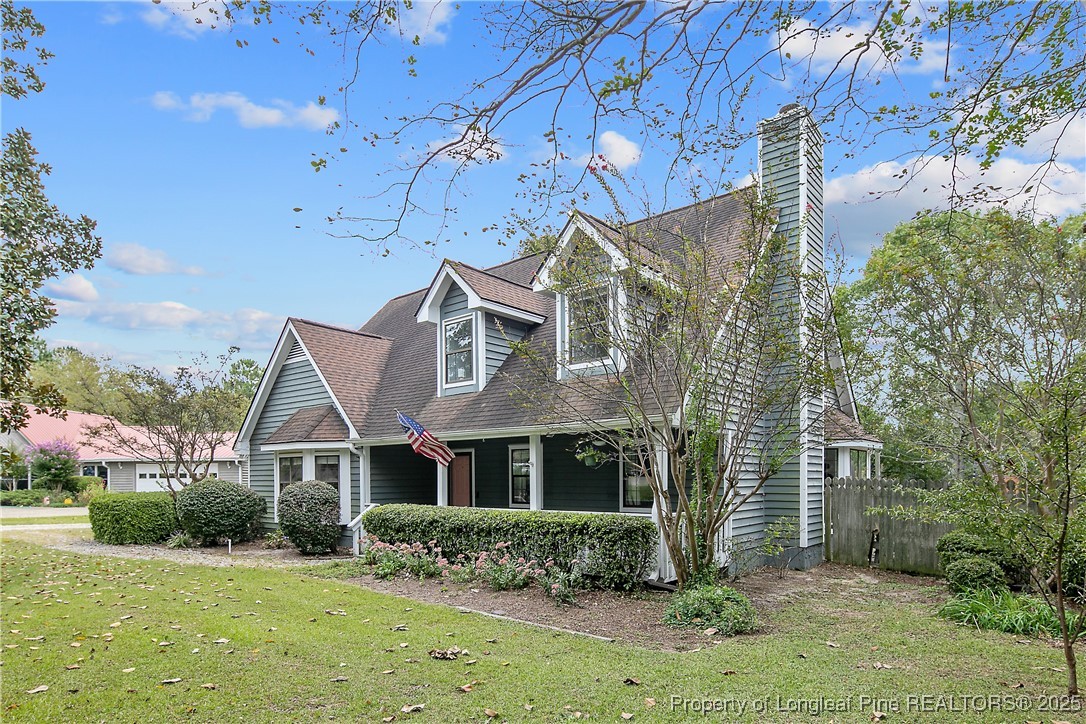 64 California Lane Spring Lake, NC 28390 - Photo 3 of 50 a front view of a house with a yard