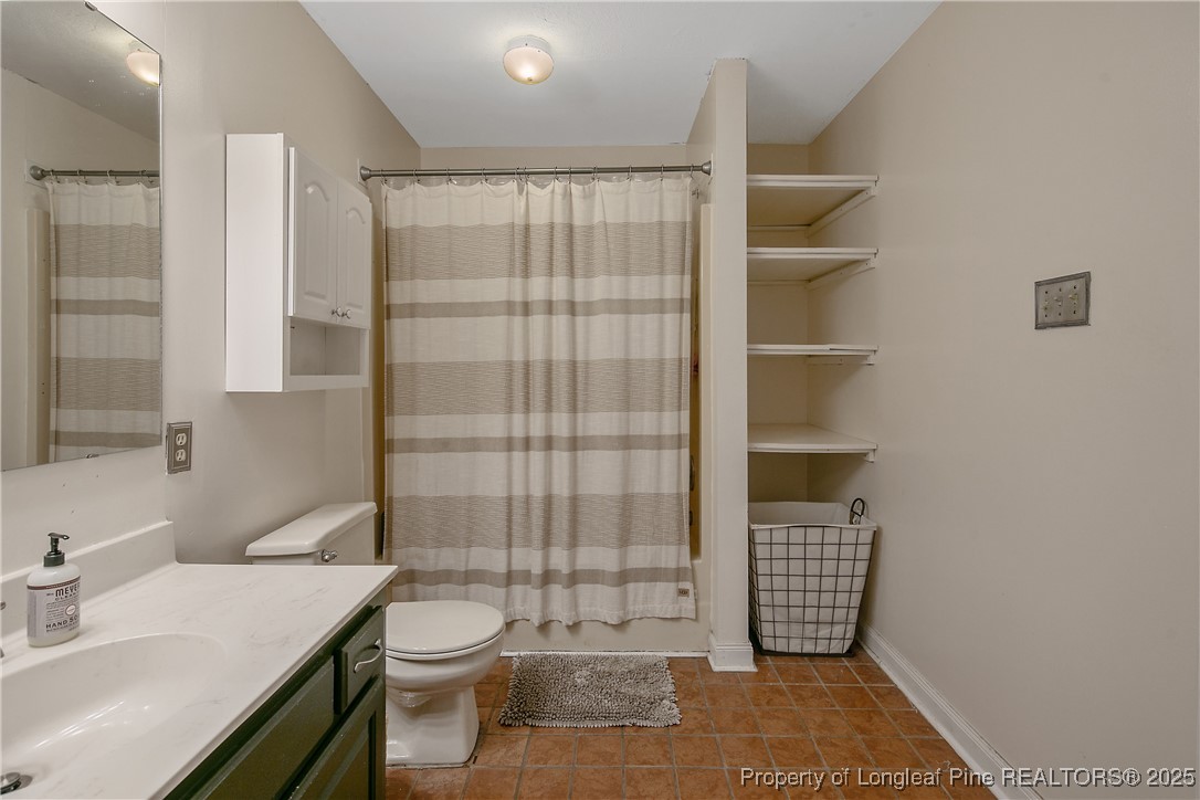 64 California Lane Spring Lake, NC 28390 - Photo 31 of 50 a bathroom with a sink toilet and shower