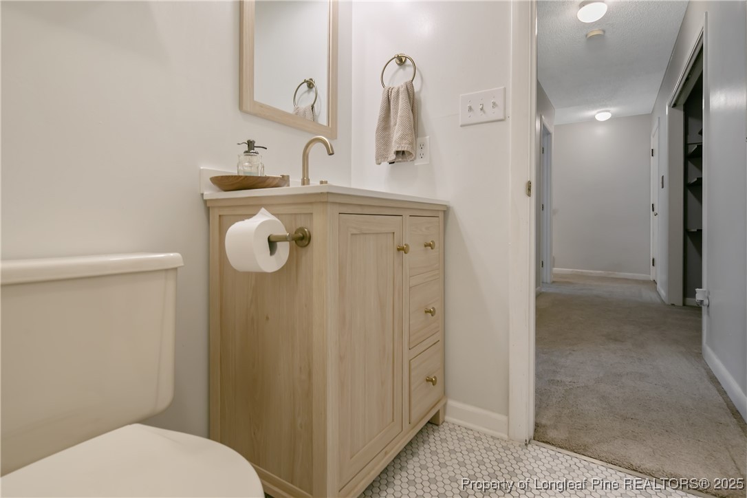 64 California Lane Spring Lake, NC 28390 - Photo 38 of 50 a bathroom with a sink a toilet and shower