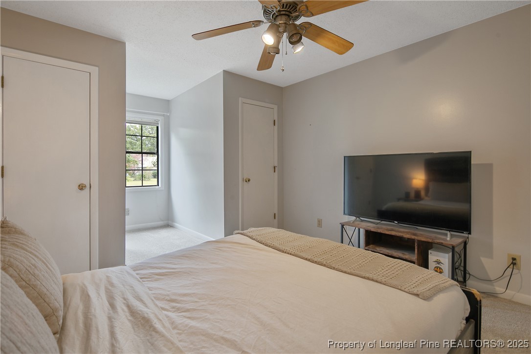 64 California Lane Spring Lake, NC 28390 - Photo 40 of 50 a bedroom with a bed and a flat screen tv