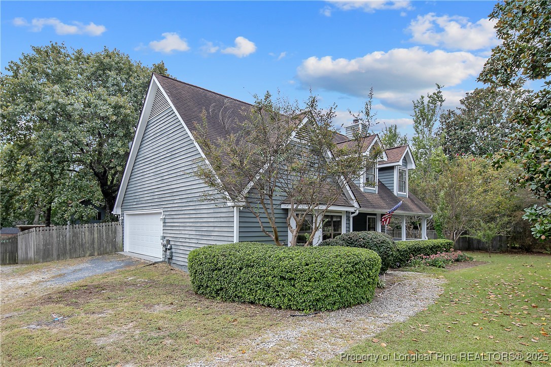 64 California Lane Spring Lake, NC 28390 - Photo 4 of 50 front view of a house with a big yard