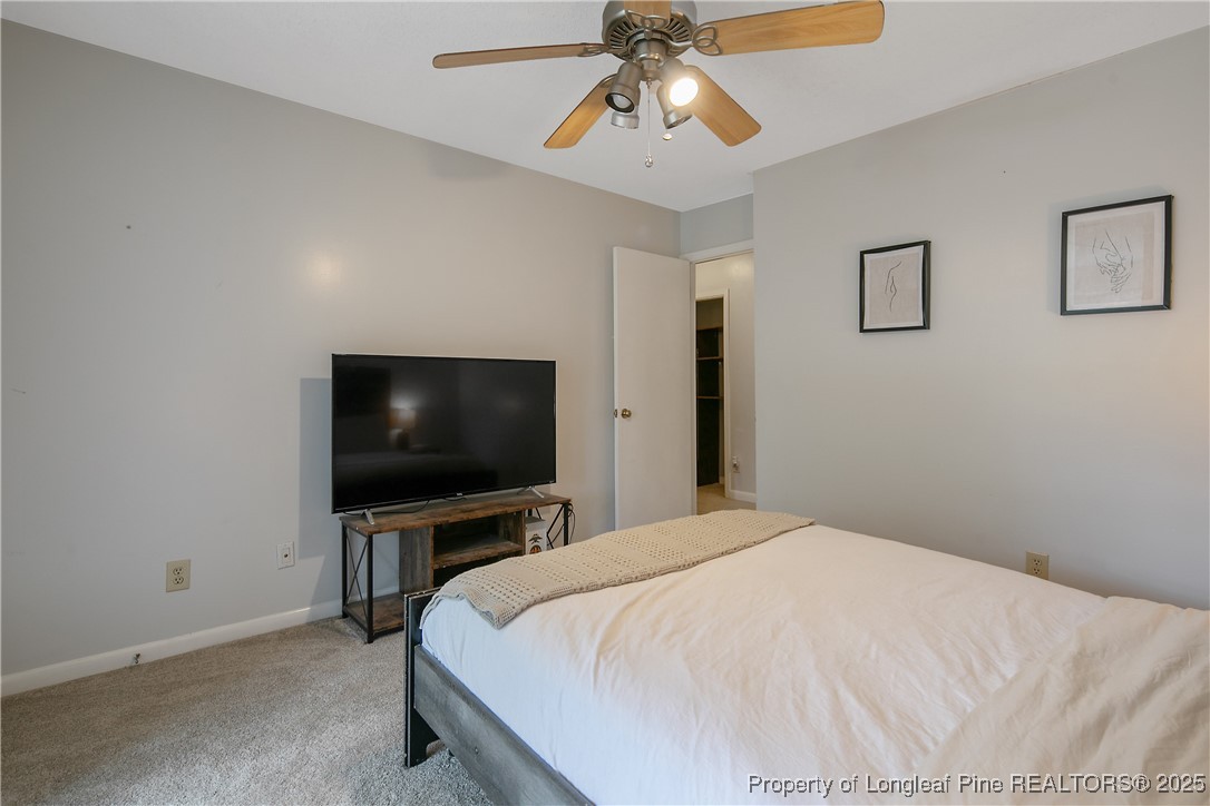 64 California Lane Spring Lake, NC 28390 - Photo 41 of 50 a bedroom with a bed and a flat screen tv