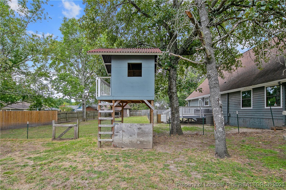 64 California Lane Spring Lake, NC 28390 - Photo 48 of 50 a view of a house with backyard and a tree