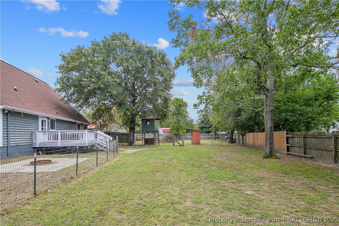 64 California Lane Spring Lake, NC 28390 - Photo 50 of 50 a view of a house with a yard porch and sitting area