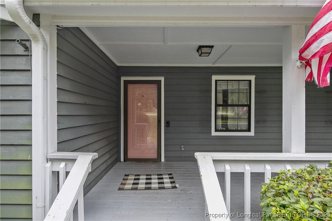 64 California Lane Spring Lake, NC 28390 - Photo 5 of 50 a front view of a house with a garage