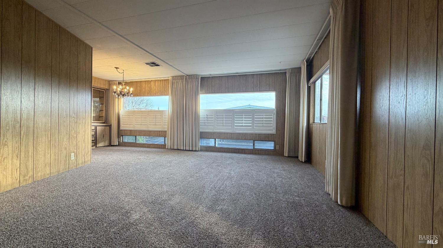 145 Stratford Way Santa Rosa, CA 95401 - Photo 11 of 48 wooden floor and windows in an empty room
