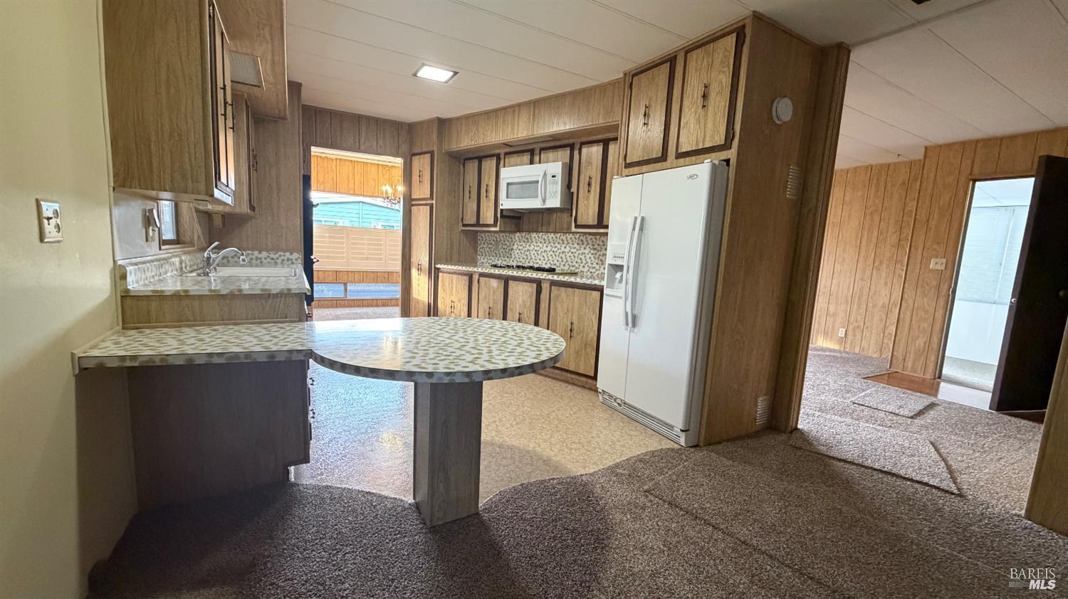 145 Stratford Way Santa Rosa, CA 95401 - Photo 16 of 48 a kitchen with refrigerator and cabinets
