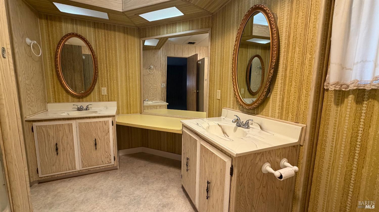 145 Stratford Way Santa Rosa, CA 95401 - Photo 26 of 48 a bathroom with a sink and a mirror