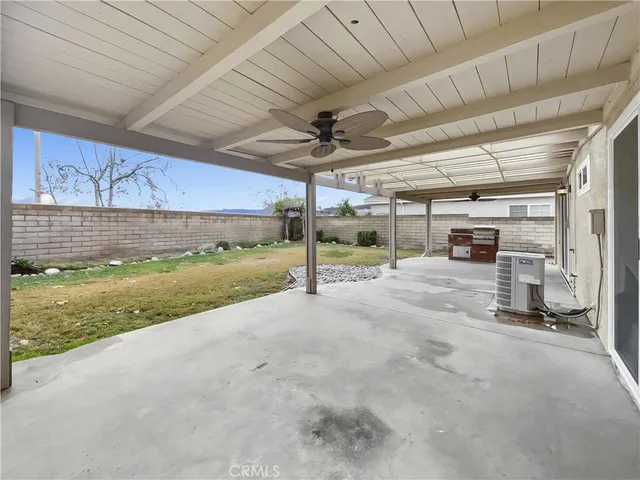 a view of a livingroom with a table and chairs