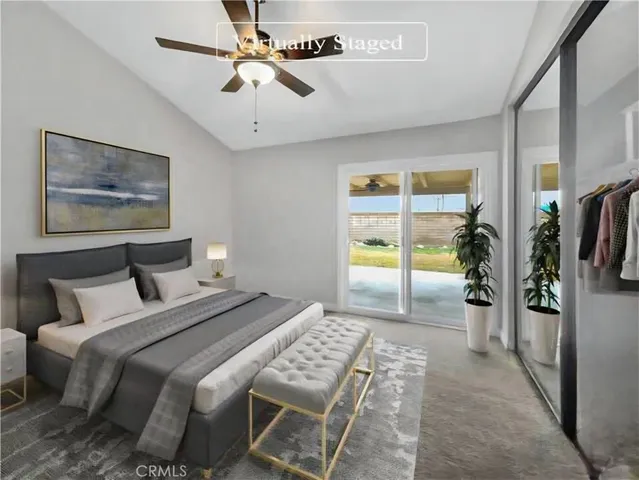 a bedroom with a balcony a bed and a window