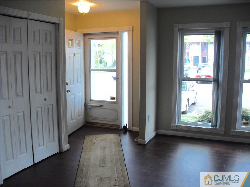 217 Probasco Road East Windsor, NJ 08520 - Photo 3 of 15 a view of hallway with yard and wooden floor
