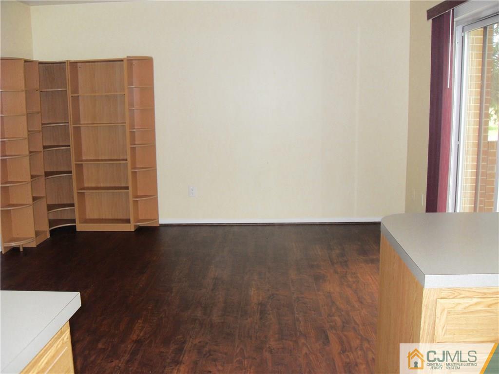 217 Probasco Road East Windsor, NJ 08520 - Photo 7 of 15 an empty room with wooden floor and windows