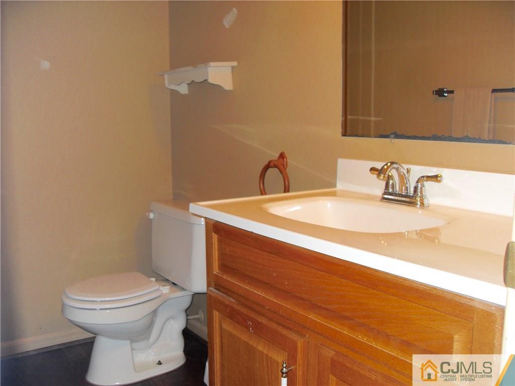 217 Probasco Road East Windsor, NJ 08520 - Photo 8 of 15 a bathroom with a sink and a toilet