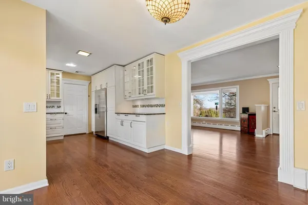 an empty room with furniture and a fireplace