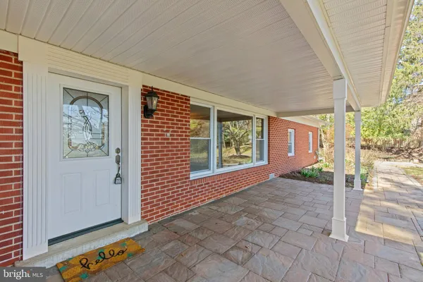a view of an empty room with windows