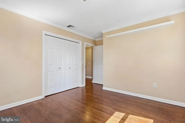 a view of an empty room with wooden walls