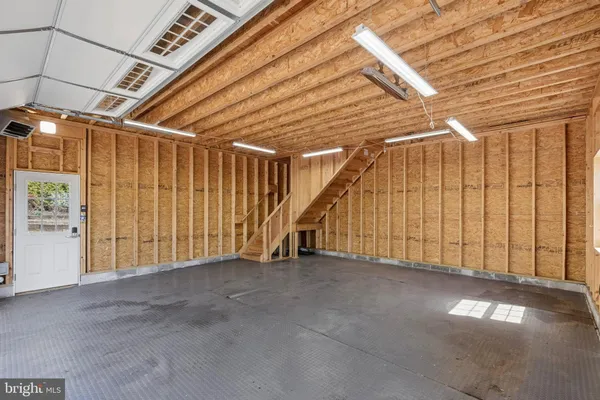a house view with a sitting space and garden