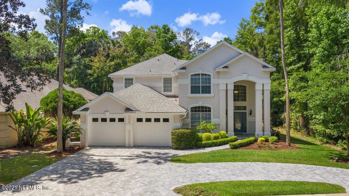 417 Big Tree Road Ponte Vedra Beach, FL 32082 - Photo 1 of 40 a front view of a house with a yard and garage