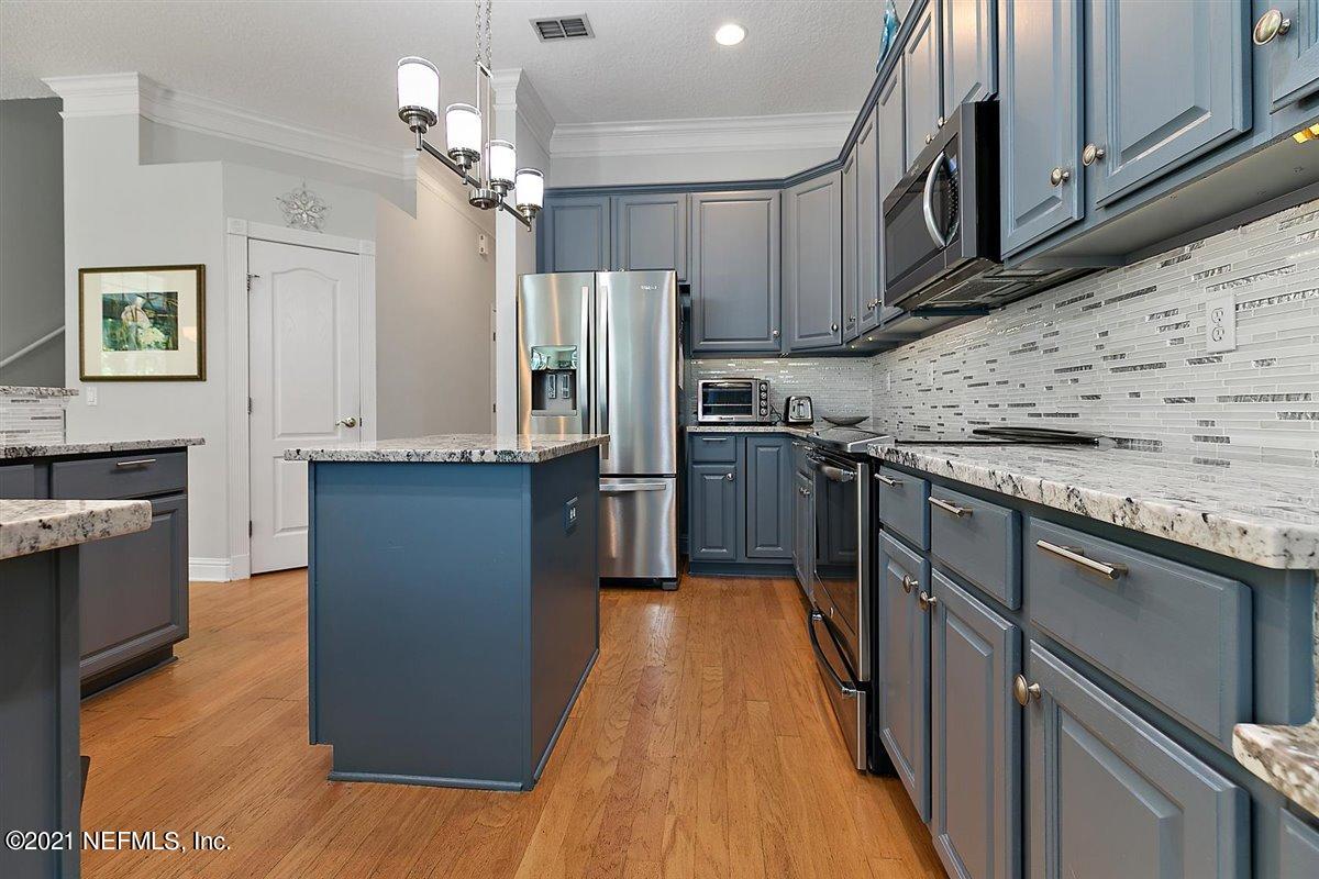 417 Big Tree Road Ponte Vedra Beach, FL 32082 - Photo 10 of 40 a kitchen with stainless steel appliances granite countertop a refrigerator a stove top oven a sink and dishwasher