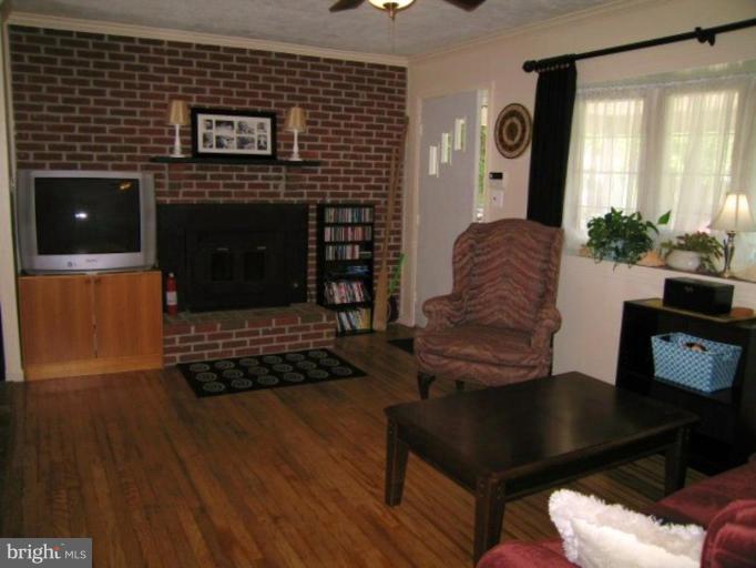 7854 Shellye Road Glen Burnie, MD 21060 - Photo 3 of 22 This living room photo shows the Fireplace