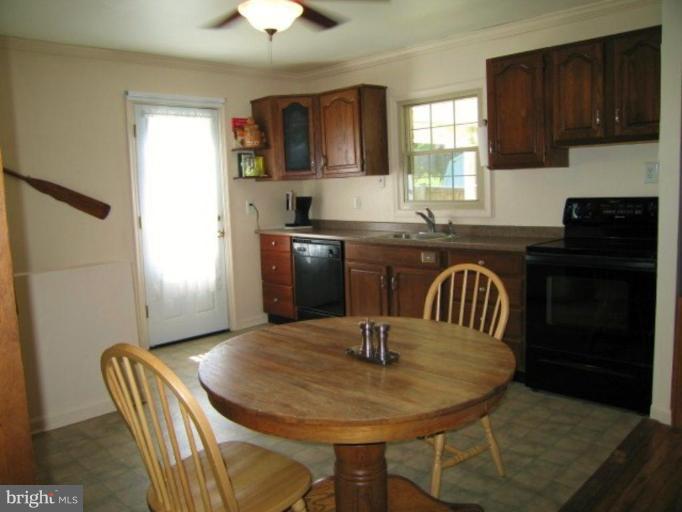 7854 Shellye Road Glen Burnie, MD 21060 - Photo 4 of 22 Large Eat-in Kitchen with a door to the back deck.