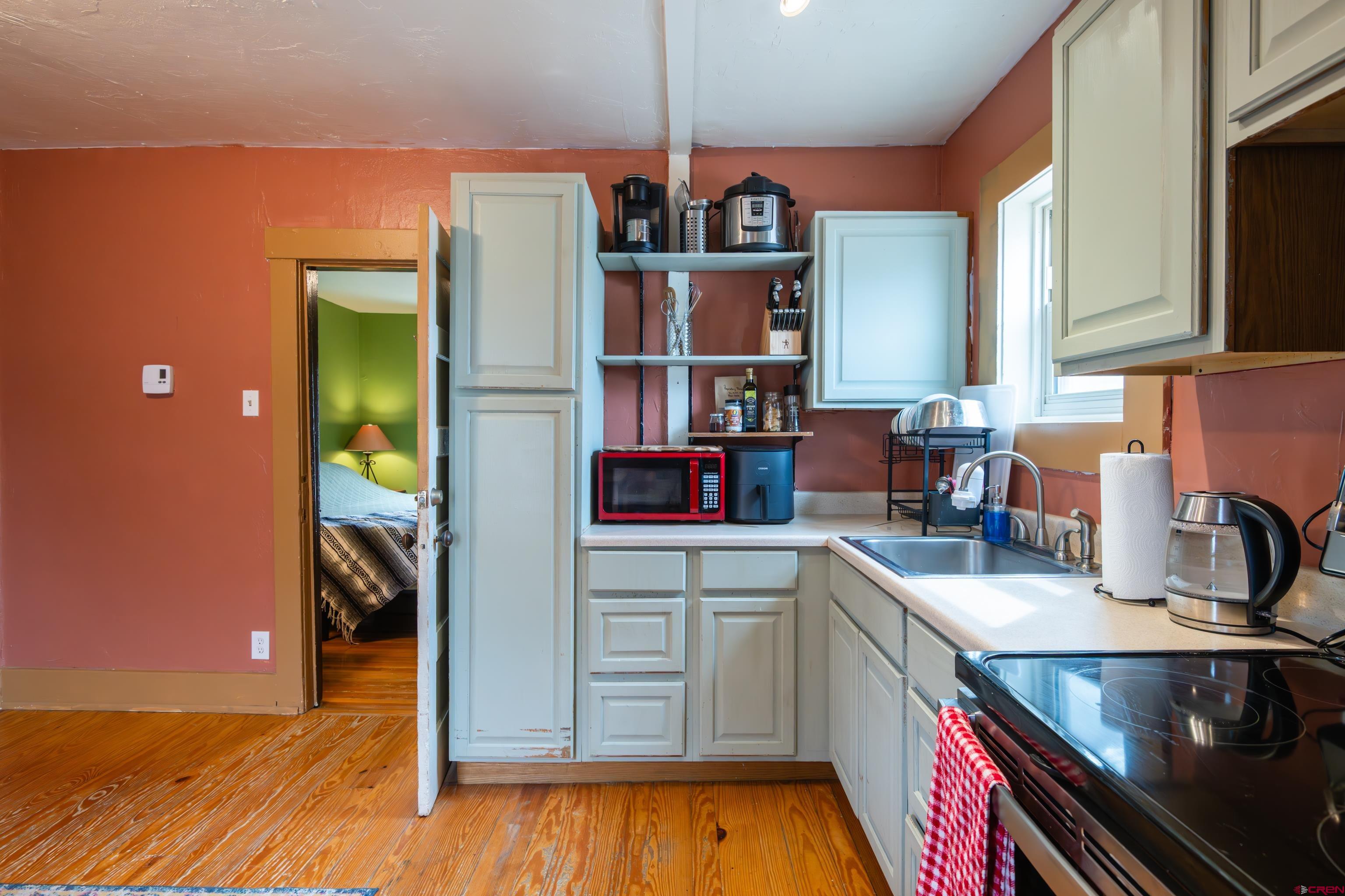 101 North 10th Street, Unit 2 Gunnison, CO 81230 - Photo 17 of 28 a kitchen that has a sink and a stove in it