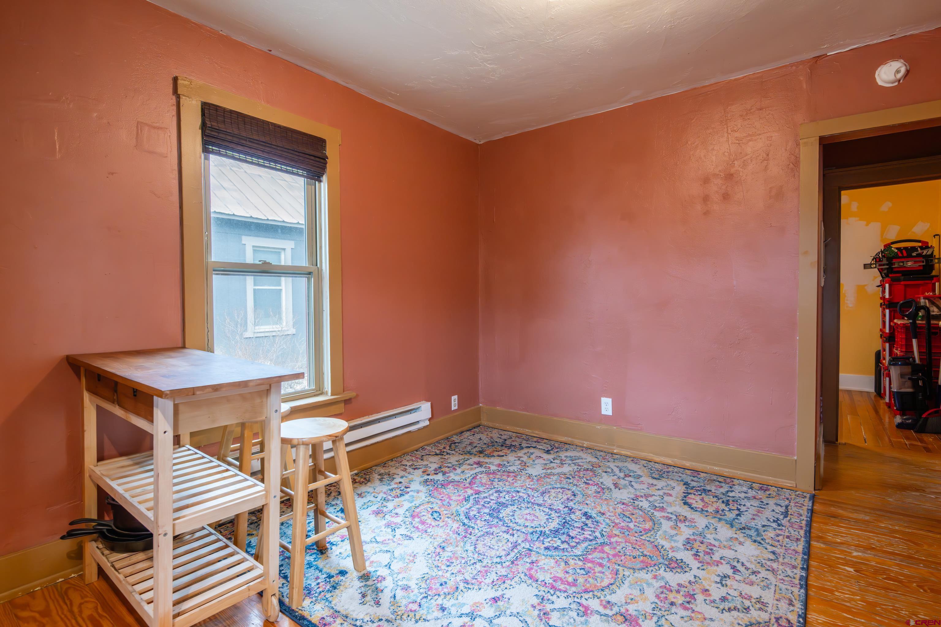101 North 10th Street, Unit 2 Gunnison, CO 81230 - Photo 18 of 28 a view of a livingroom with furniture and wooden floor