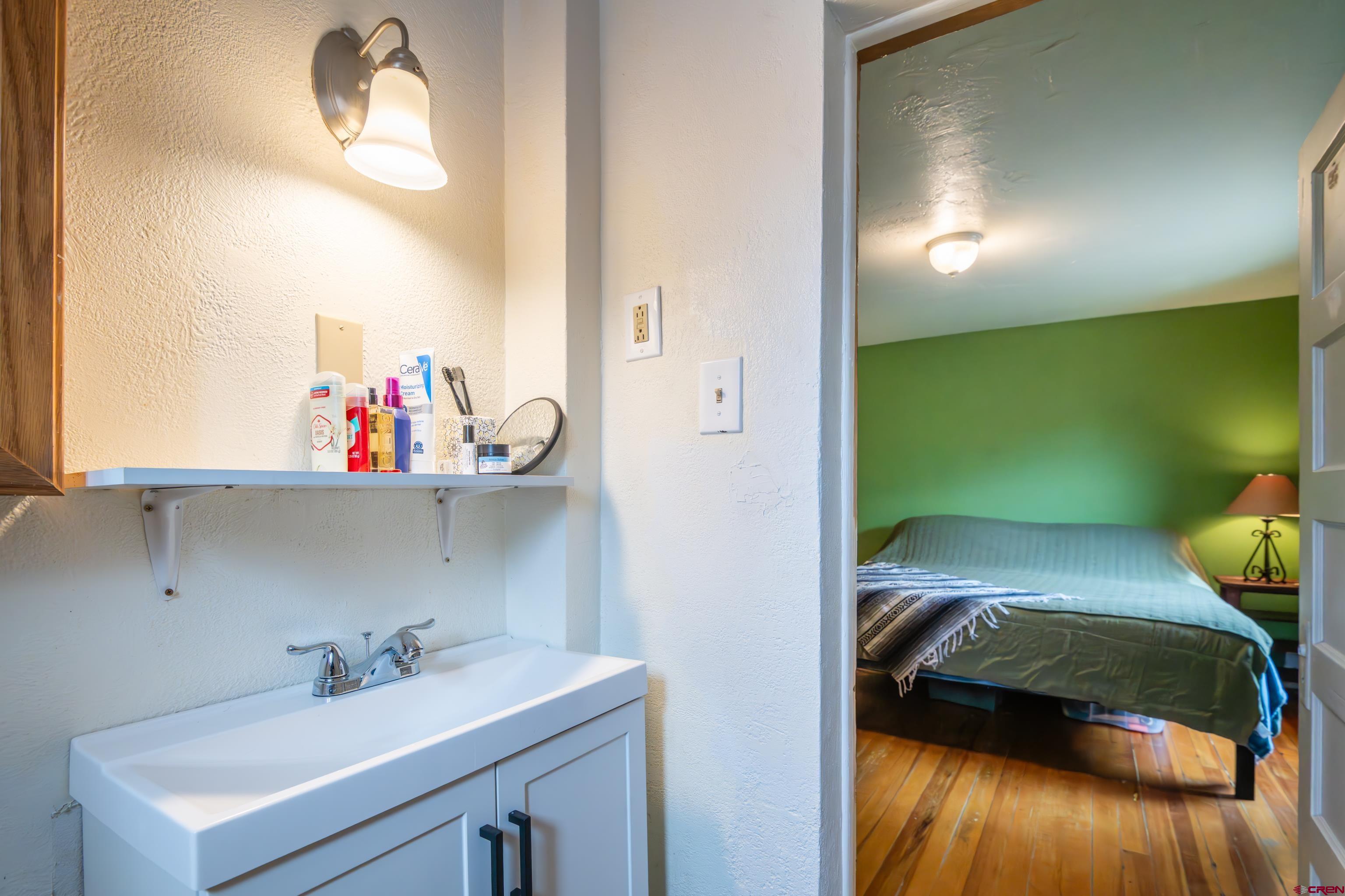 101 North 10th Street, Unit 2 Gunnison, CO 81230 - Photo 22 of 28 a bathroom with a sink and a mirror