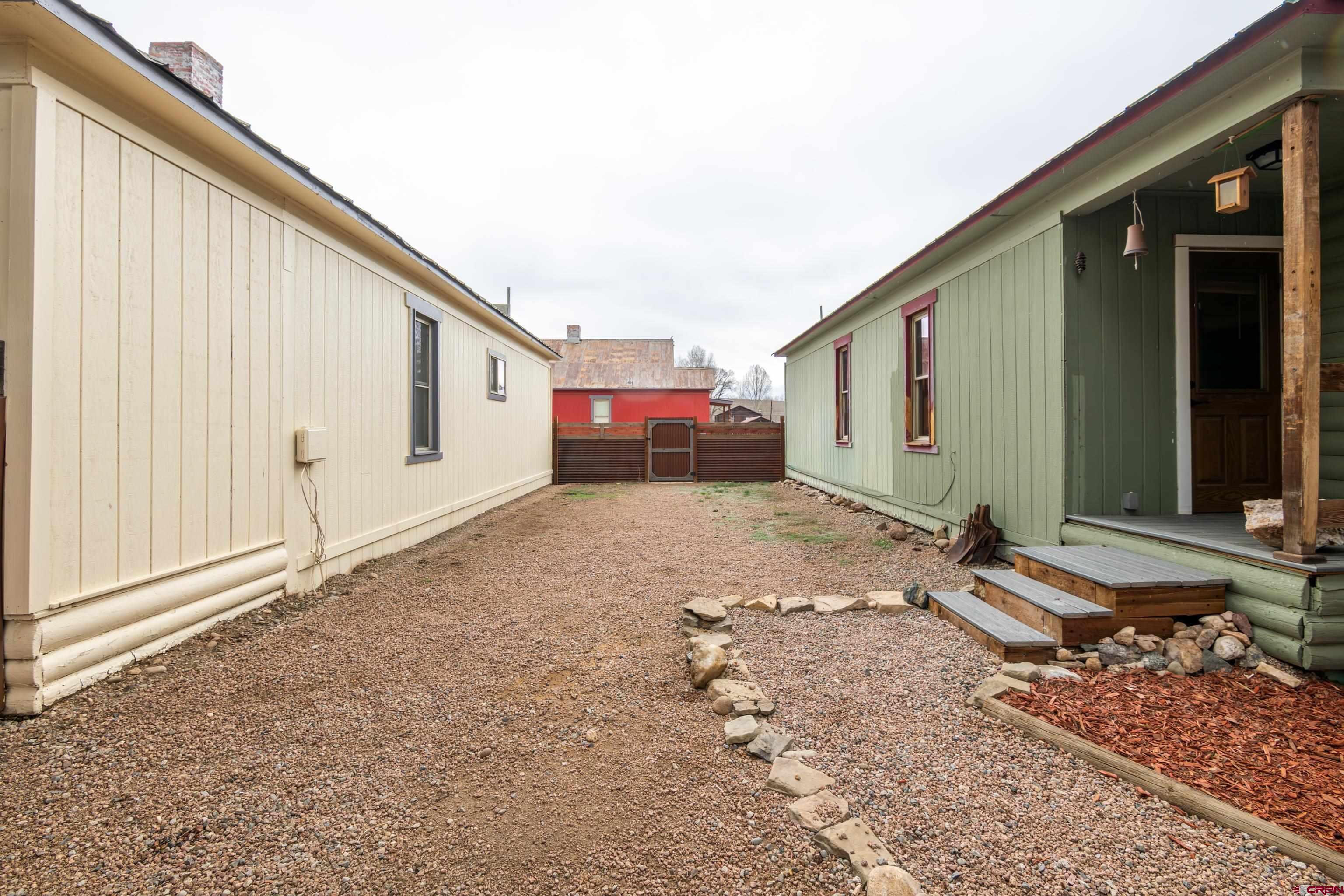 101 North 10th Street, Unit 2 Gunnison, CO 81230 - Photo 24 of 28 a view of a house with backyard and sitting area