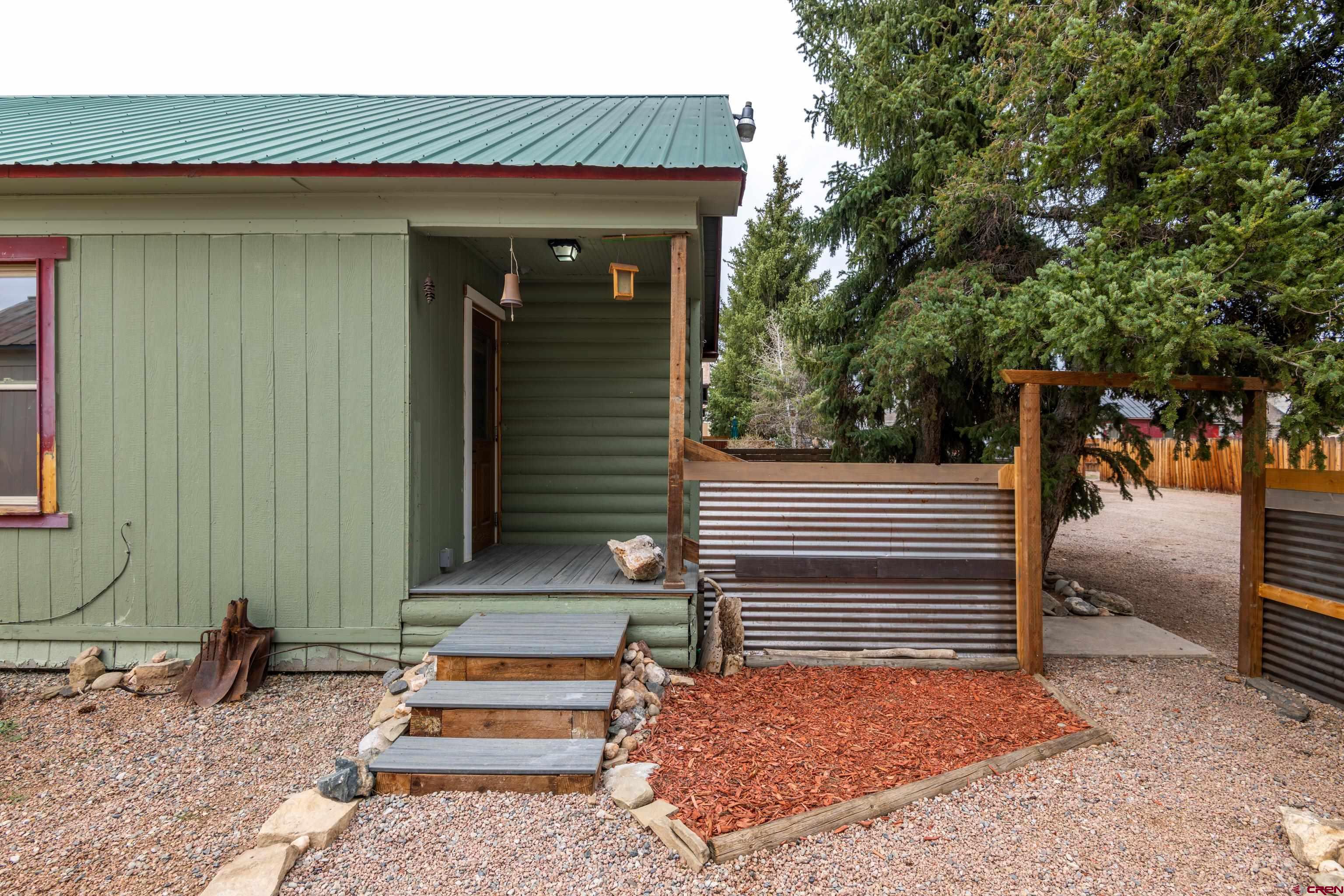 101 North 10th Street, Unit 2 Gunnison, CO 81230 - Photo 3 of 28 a front view of a house with stairs