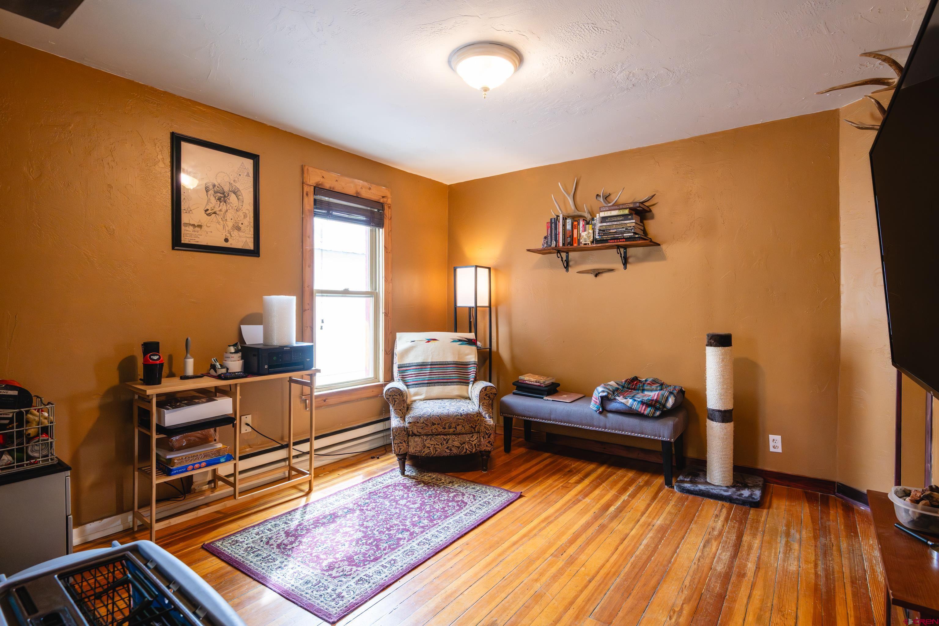 101 North 10th Street, Unit 2 Gunnison, CO 81230 - Photo 7 of 28 a living room with furniture and wooden floor