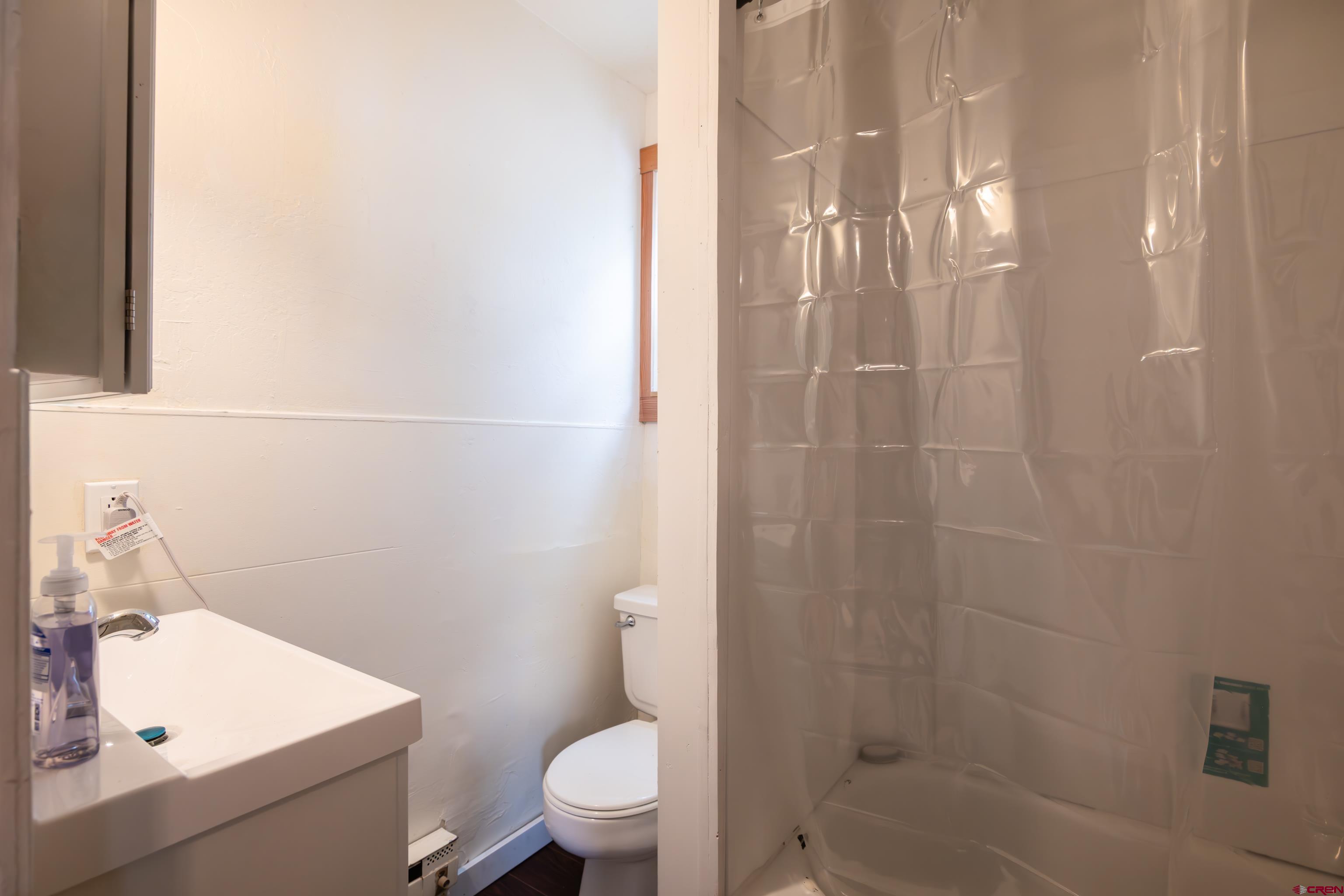 101 North 10th Street, Unit 2 Gunnison, CO 81230 - Photo 9 of 28 a bathroom with a sink a toilet and shower