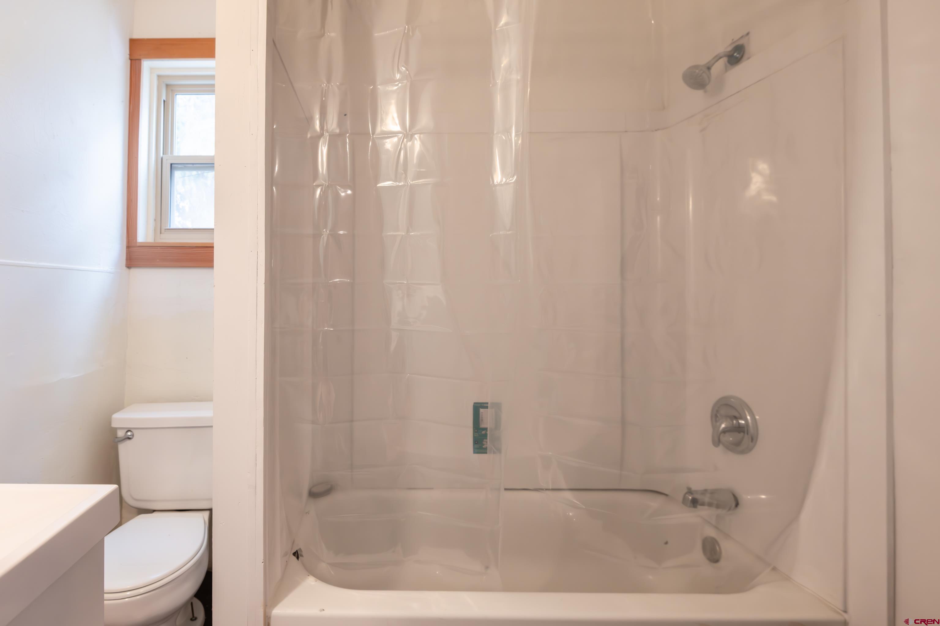 101 North 10th Street, Unit 2 Gunnison, CO 81230 - Photo 10 of 28 a bathroom with a bathtub and a toilet