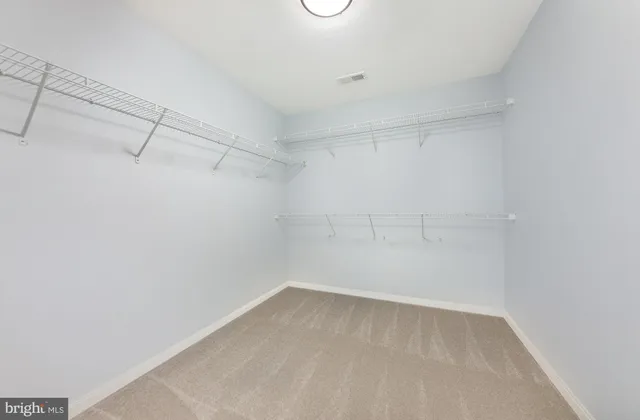 a view of a room with racks on the wall