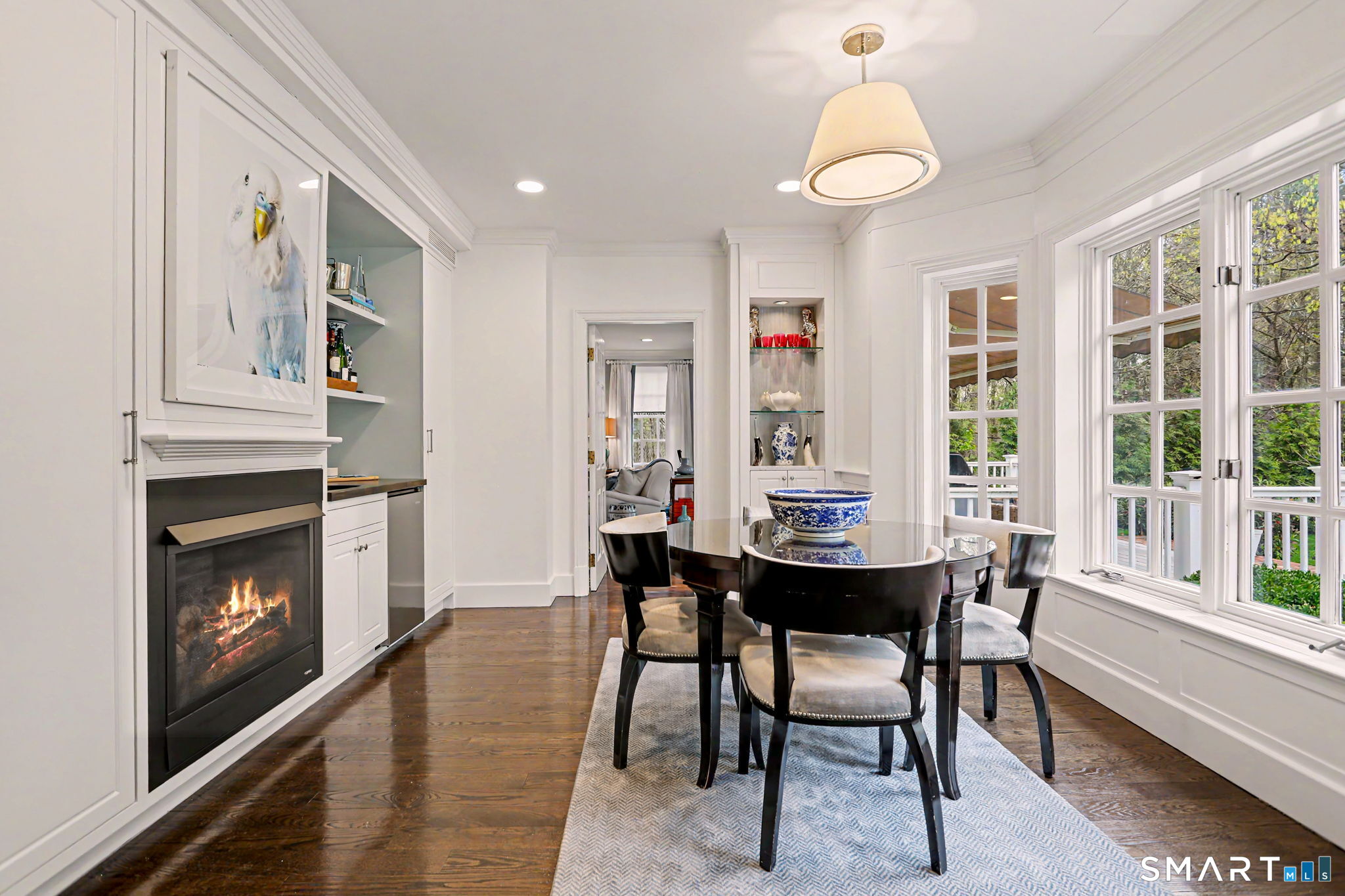 66 Gate Stone Lane Fairfield, CT 06824 - Photo 18 of 39 Kitchen dining area, with custom wet bar and gas fireplace