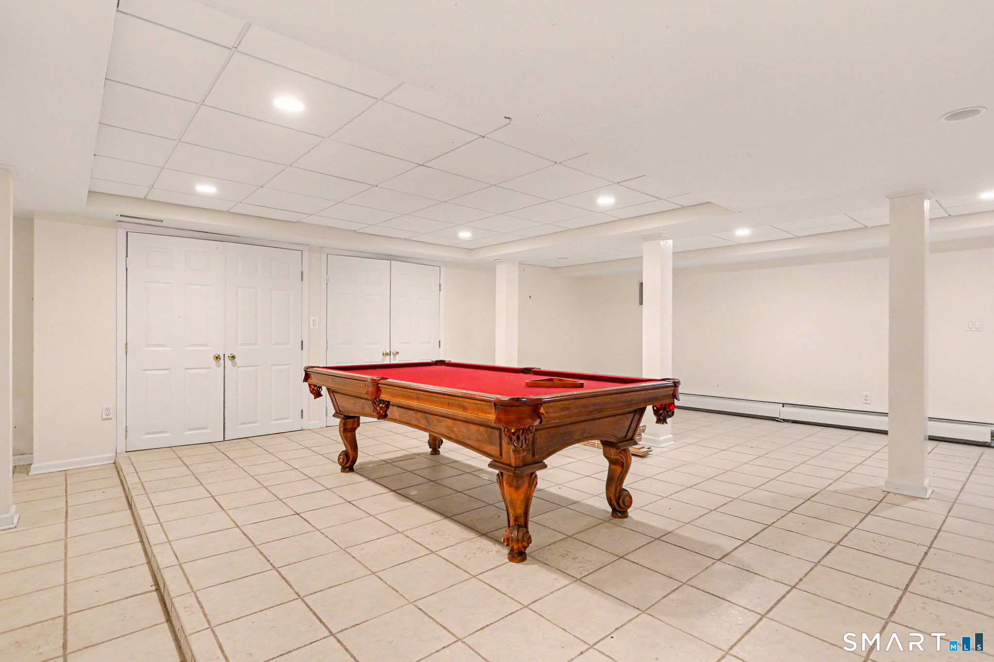 66 Gate Stone Lane Fairfield, CT 06824 - Photo 31 of 39 Lower level game room with fireplace