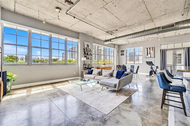 a living room with furniture and a table