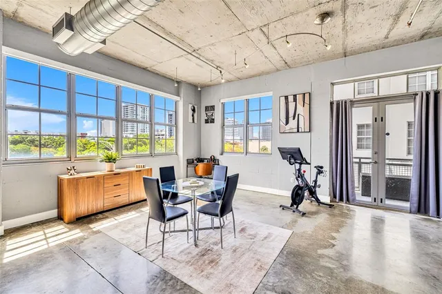a view of a dining room with furniture window and outside view