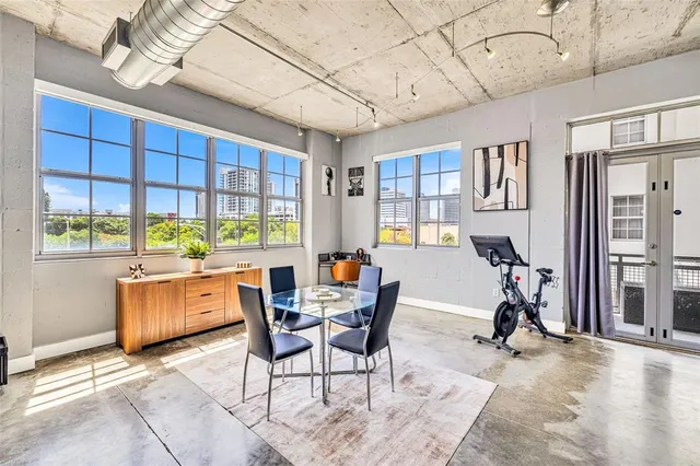 a view of a livingroom with furniture and a window