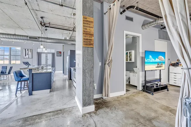 an aerial view of multi story residential apartment building with yard