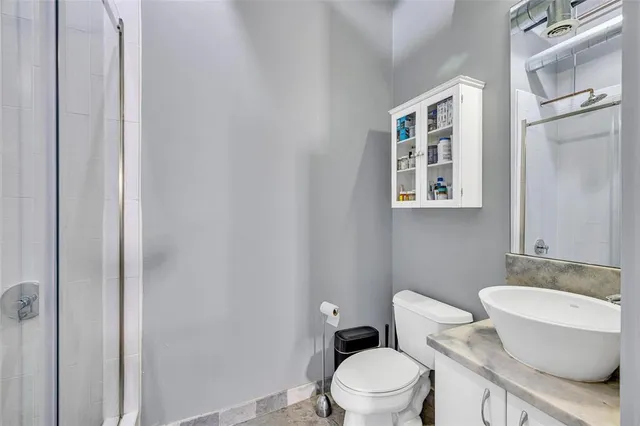 an aerial view of city with tall buildings