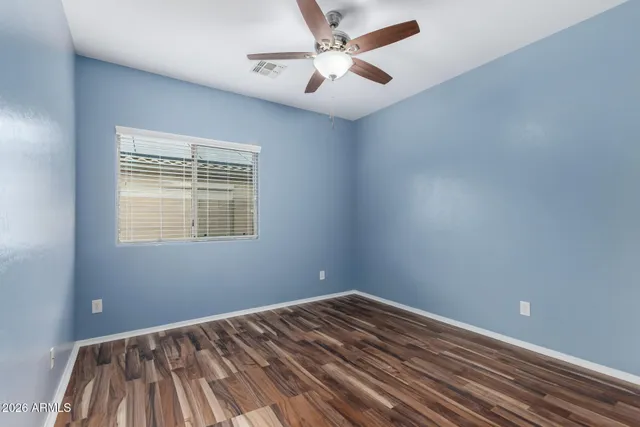 a view of a room with a ceiling fan