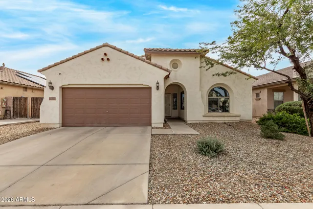 a view of a white house with a outdoor space