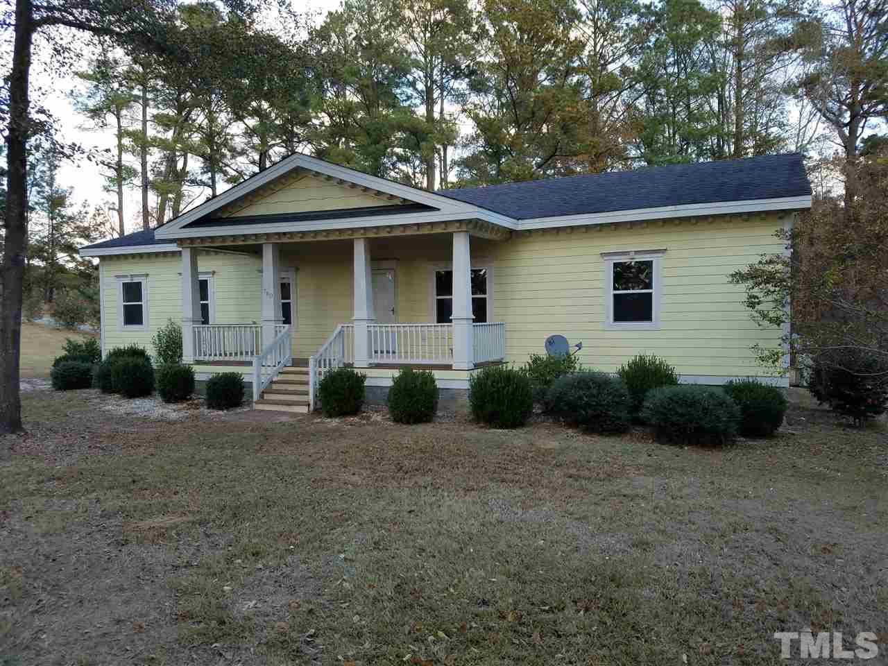 760 Bill Avery Road Coats, NC 27521 - Photo 2 of 14 a front view of a house with a garden