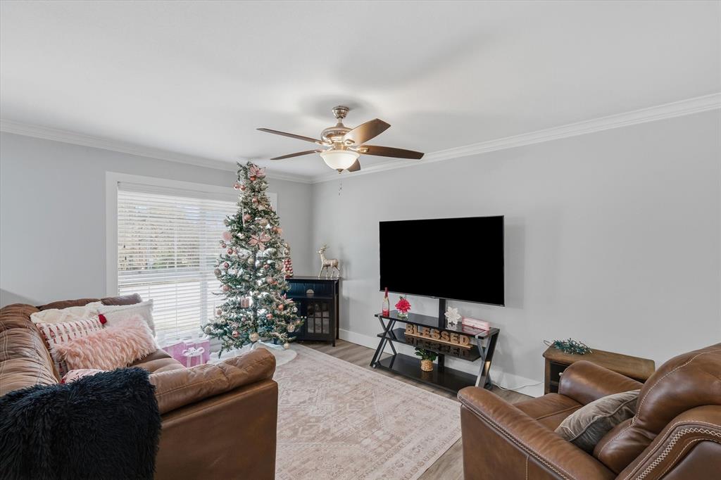 2422 Old Omen Road Tyler, TX 75701 - Photo 13 of 39 a living room with furniture and a flat screen tv