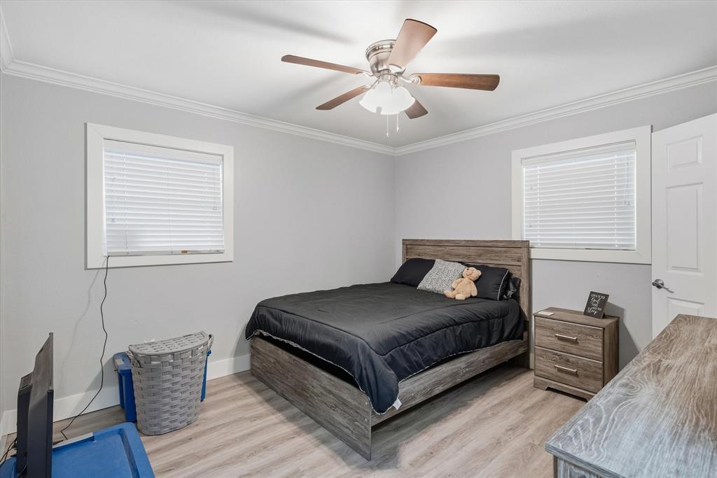 2422 Old Omen Road Tyler, TX 75701 - Photo 20 of 39 a living room with a bed furniture and a window