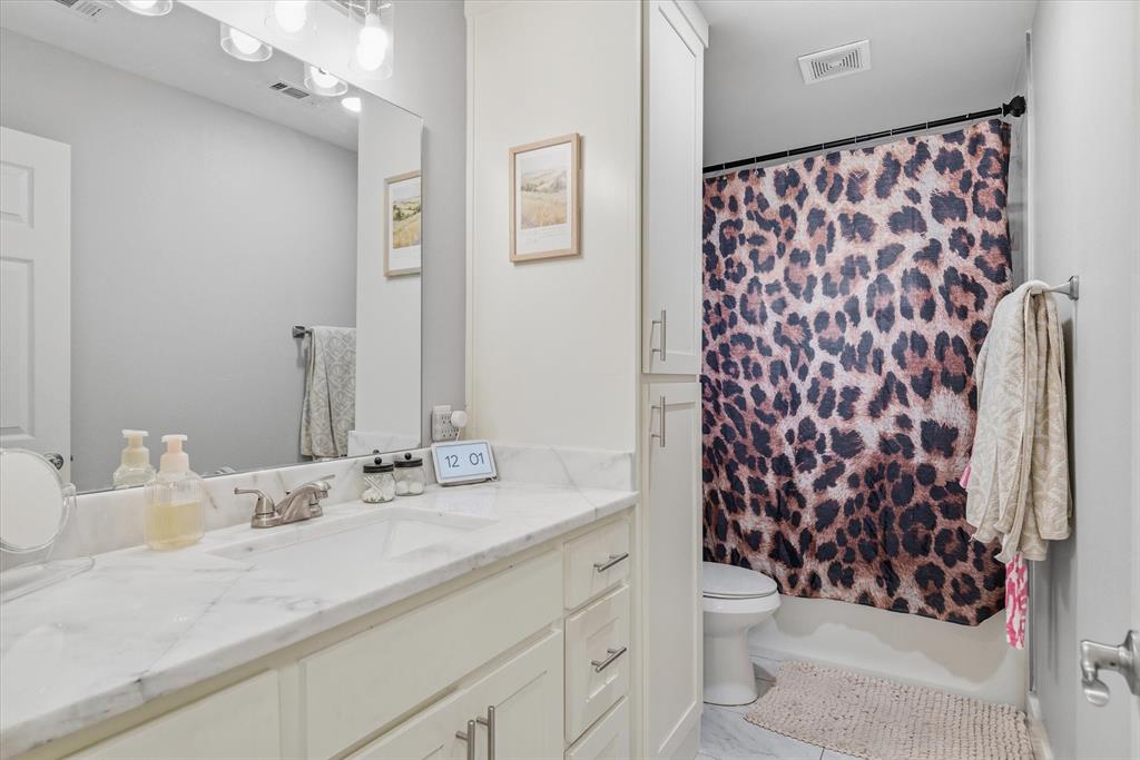 2422 Old Omen Road Tyler, TX 75701 - Photo 21 of 39 a bathroom with a sink and a mirror