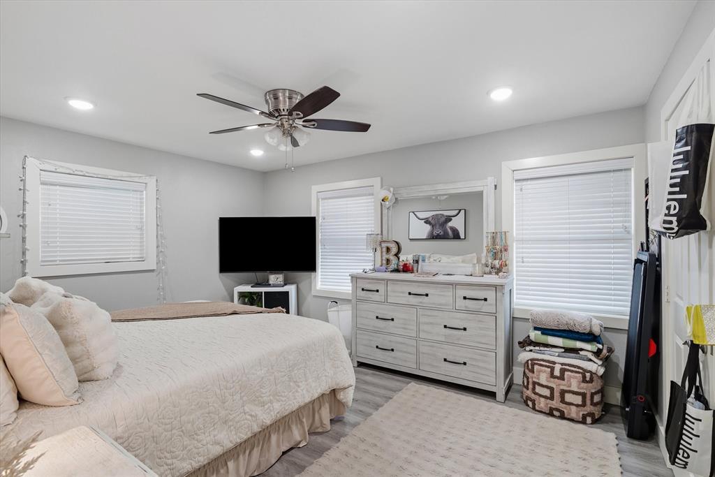 2422 Old Omen Road Tyler, TX 75701 - Photo 22 of 39 a bedroom with a bed and a flat screen tv