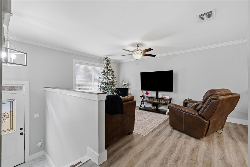 2422 Old Omen Road Tyler, TX 75701 - Photo 23 of 39 a living room with furniture and a flat screen tv
