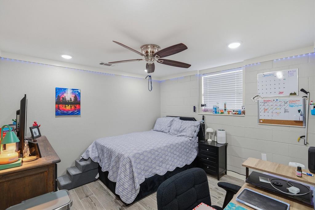 2422 Old Omen Road Tyler, TX 75701 - Photo 24 of 39 a bedroom with a bed and furniture